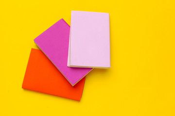Books on a yellow background