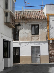 Old house with traditional tiles in quiet Tarifa side street