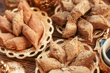 Turkish sweets with coffee on a wooden table