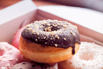 Glazed colored donuts background image. Macro shot