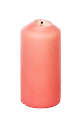 Wax colored candle isolated on white background close up