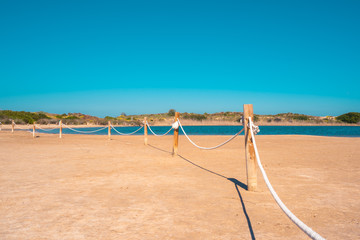 Albufera Lake. Prohibited to swim. Unsafe waters. Summer holidays fences and white rope...