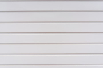 Texture of striped white wooden garage door.