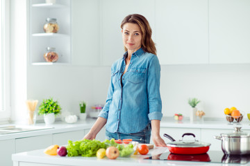 Portrait of her she nice lovely attractive content brown-haired lady ready to make new fresh recipe hot dish meal snack dinner lunch spend free time in light white interior style kitchen