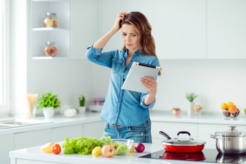 Obraz na płótnie Canvas Portrait of her she nice lovely attractive confused brown-haired lady thinking how to prepare fresh hot dish meal dinner lunch green eco delicacy in light white interior style kitchen