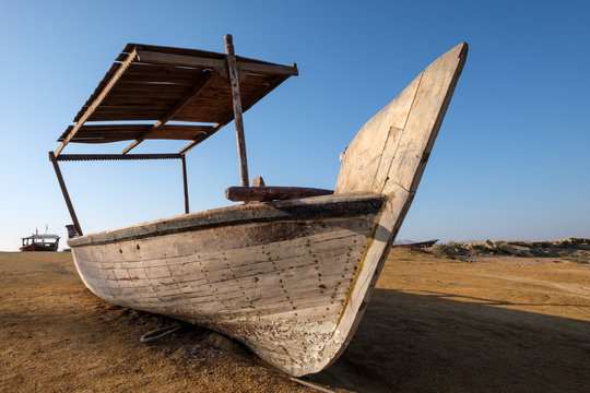 Fisher boat during sunrise on the beach of Qeshm Island in the Persian Gulf Iran
