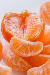 juicy mandarin on a white acrylic background