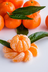 juicy mandarin on a white acrylic background