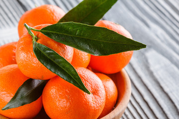 juicy mandarin on a gray wooden rustic background