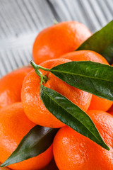 juicy mandarin on a gray wooden rustic background