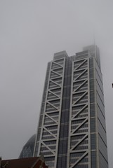Skyscraper and foggy sky