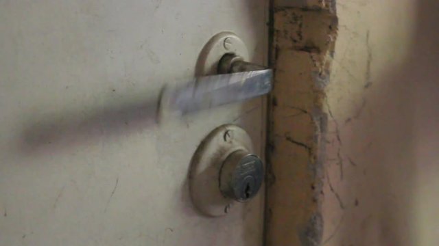 Stuck door handle being tried to open, could be a scary situation as someone trying to break in, or a normal situation like someone who forgot their keys.