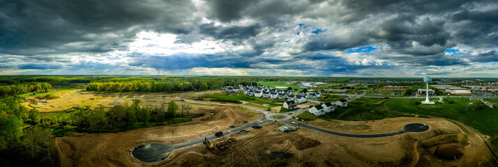 Aerial panorama of new construction luxury residential neighborhood street with American single family homes in Maryland USA real estate