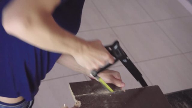 High Angle Young Woman Sawing Board Indoors