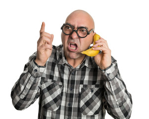 Discutiendo por teléfono con plátano