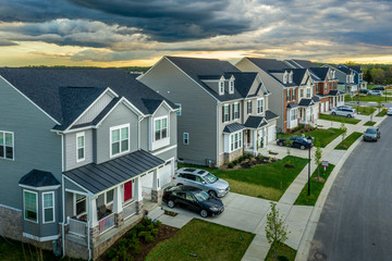 Aerial view of typical American new construction neighborhood street in Maryland for the upper...