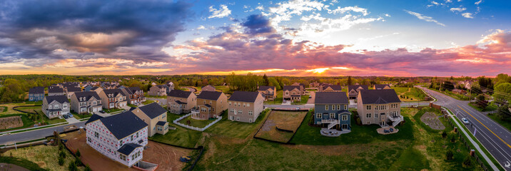 Aerial view of new construction street with luxury houses in a Maryland upper middle class...