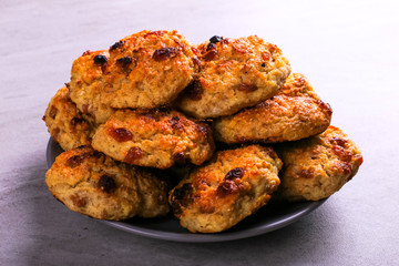 Baked cottage cheese and oatmeal cookies with raisins. Healthy nutrition, diet food.