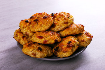 Baked cottage cheese and oatmeal cookies with raisins. Healthy nutrition, diet food.