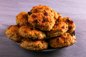 Baked cottage cheese and oatmeal cookies with raisins. Healthy nutrition, diet food.