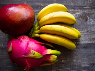Fresh fruits: pitahaya (dragon fruit), mini bananas, mango