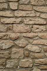 Front view of the old stone wall in the dessert town of northern Chile, South America
