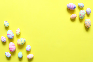 Easter eggs on yellow background. The view from the top.