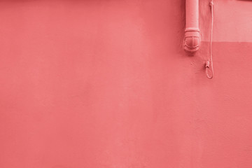 Grungle wall close-up colored in living coral color