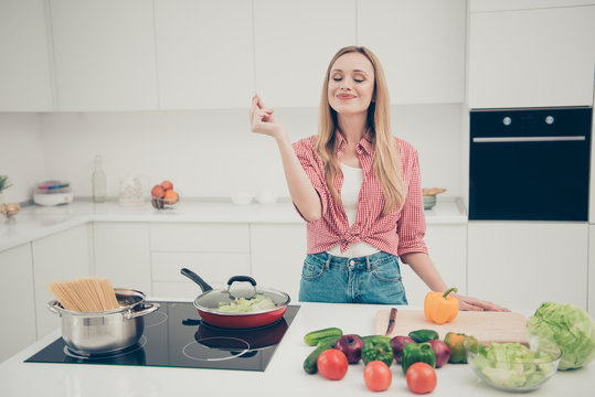 Close up photo beautiful she her lady fingers belissimo okey symbol check quality advising meal dish expert yummy wear domestic home apparel shirt jeans denim outfit bright home kitchen indoors