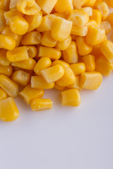 Canned corn on a white acrylic background