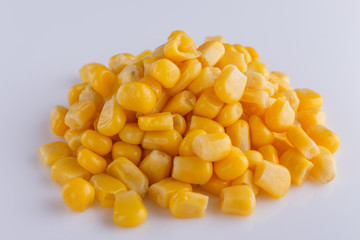 Canned corn on a white acrylic background