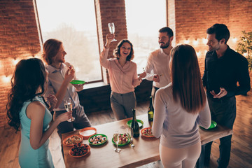 Above high angle view of nice best elegant trendy attractive pretty cheerful positive guys ladies having fun enjoying spending time house tradition brunch in industrial loft interior room indoors