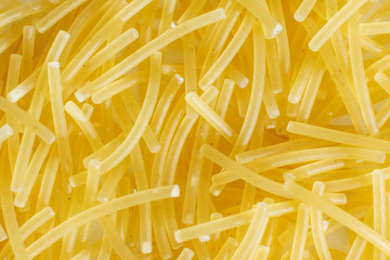 Pasta, vermicelli close-up. Macro photography. Unprepared food. Top view.