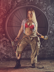 Beautiful girl in construction clothes