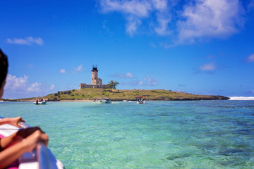 Fototapeta premium Happy beautiful family, children and parents, dressed in beach wear, enjoying day trip with speed boat