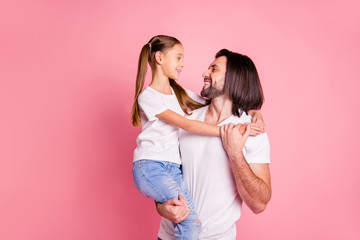 Close up photo beautiful she her little lady he him his daddy hold little princess hands arms affection sweet relax look eyes wear casual white t-shirts denim jeans isolated pink bright background