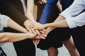 Group Many business people join hands to demonstrate harmony. The determination to work...