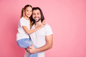 Fototapeta premium Close up photo beautiful she her little lady he him his daddy hold little princess hands arms affection sweet relax look eyes wear casual white t-shirts denim jeans isolated pink bright background