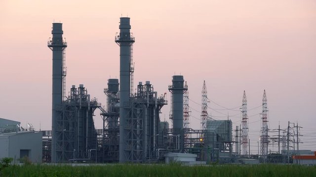 Chimney of thermal power plants at sunrise sky.