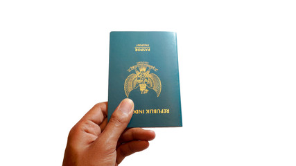 Close up hand holding indonesian passport isolated on white background - Image