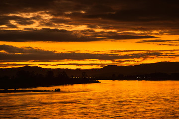 In the morning, the sun rises on the banks of the Mekong River in the Golden Triangle, Chiang Rai, Thailand.