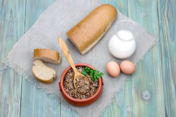Fototapeta na wymiar Buckwheat porridge on the wooden table