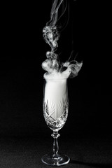 CloseUp glass with fog at dark background