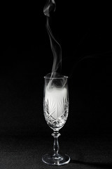 CloseUp glass with fog at dark background