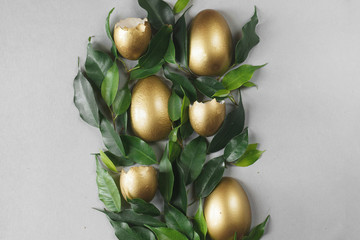 Flat lay composition with gold eggs. Easter concept