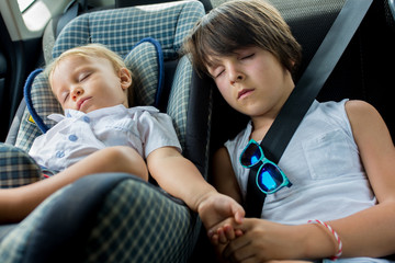Children, sleeping in carseats while traveling