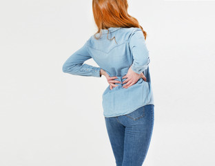 Young red hair woman holding his neck in pain. Medical concept.