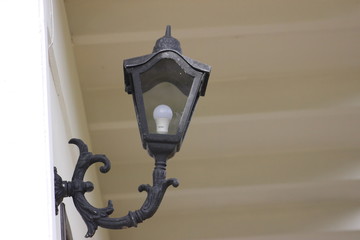 old street lamp on wall