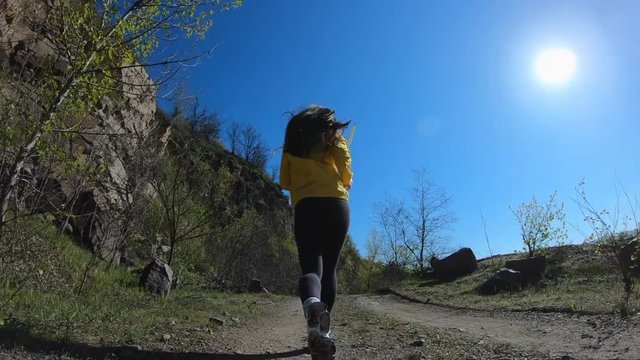 Fitness woman running on the nature, mountain landscape, fit sportive girl have activity outdoor, slow motion