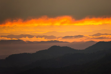 Sunrise.Mountain valley during sunrise. Natural summer landscape.Lighting before sunrise at the morning time.Thailand.